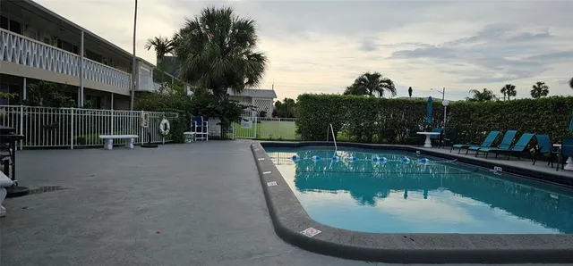 a view of a swimming pool with a patio