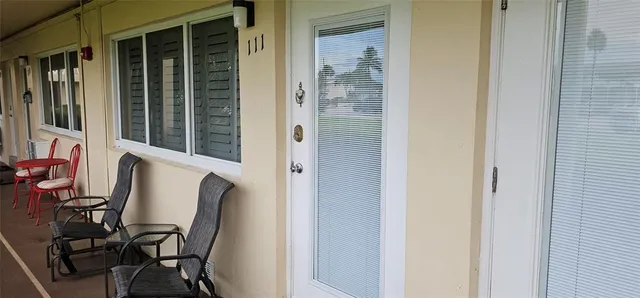 a view of a front door and bedroom