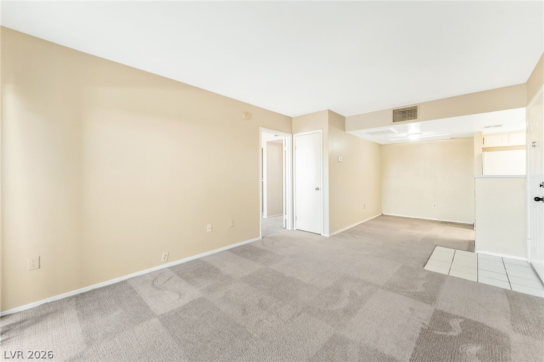 8070 West Russell Road, Unit 1054 Las Vegas, NV 89113 - Photo 5 of 22 A spacious, naturally illuminated living room awaits your personal touches.