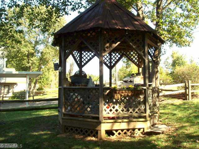1940 Riverview Road Lexington, NC 27292 - Photo 13 of 13 Other. Gazebo sits around an old well which can still be accessed. Home is connected to public water. Gas grill has hookup to the propane tanks used by the home.