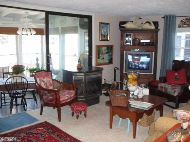 1940 Riverview Road Lexington, NC 27292 - Photo 9 of 13 Living Room. Living Room has gas logs and opens up to the sunroom/enclosed porch. Leather recliner (not in picture) and sofa stay. Great views of the lake!