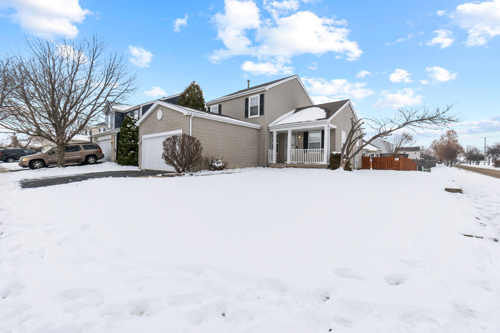 6981 Paradise Circle Plainfield, IL 60586 - Photo 1 of 1 a front view of a house with a snow in front of it