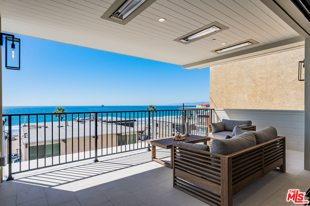 4314 Ocean Drive Manhattan Beach, CA 90266 - Photo 15 of 46 a living room with furniture a ceiling fan and a wooden floor