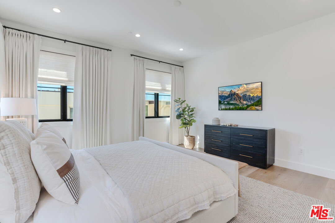 4314 Ocean Drive Manhattan Beach, CA 90266 - Photo 22 of 46 a bedroom with a bed and a dresser