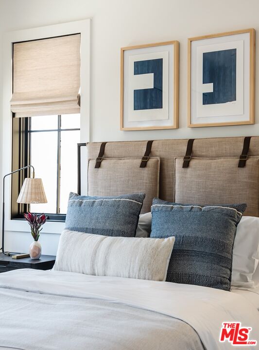 4314 Ocean Drive Manhattan Beach, CA 90266 - Photo 33 of 46 a living room with a couch and a floor to ceiling window