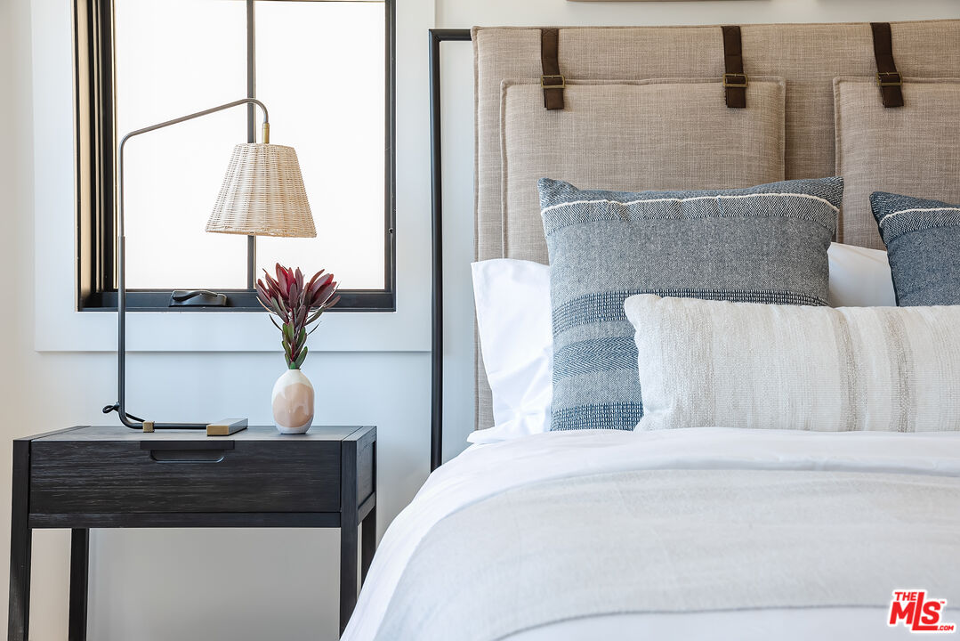 4314 Ocean Drive Manhattan Beach, CA 90266 - Photo 34 of 46 a bedroom with a bed and lamps