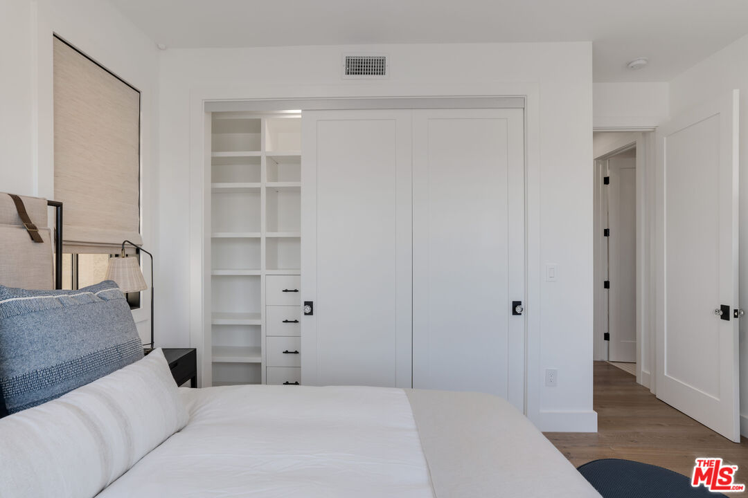 4314 Ocean Drive Manhattan Beach, CA 90266 - Photo 35 of 46 a bedroom with a bed and a walk in closet