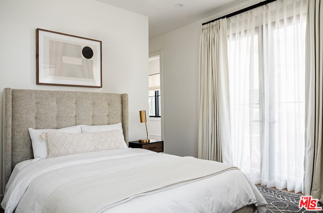 4314 Ocean Drive Manhattan Beach, CA 90266 - Photo 43 of 46 a bedroom with bed and a window