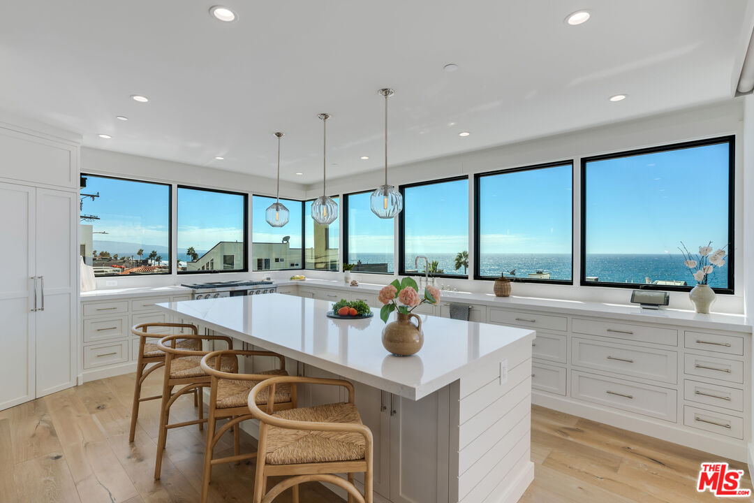 4314 Ocean Drive Manhattan Beach, CA 90266 - Photo 7 of 46 a kitchen with stainless steel appliances a large counter top