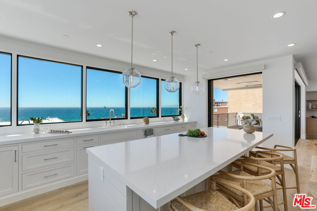 4314 Ocean Drive Manhattan Beach, CA 90266 - Photo 8 of 46 a large kitchen with kitchen island a large window