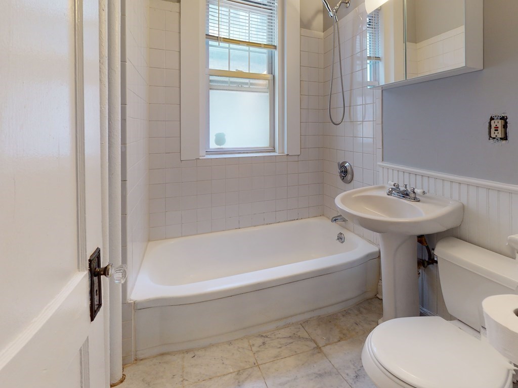 59 Lanark Road, Unit 4 Boston, MA 02135 - Photo 12 of 25 a bathroom with a sink a toilet and bathtub