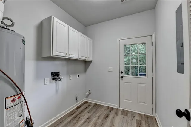 a view of a storage and utility room with a window