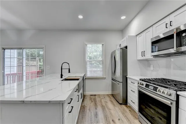 a kitchen with a sink and a window