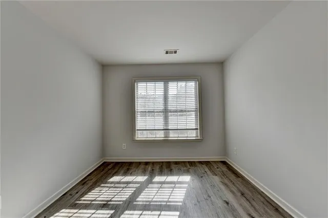 a bathroom with a shower and toilet