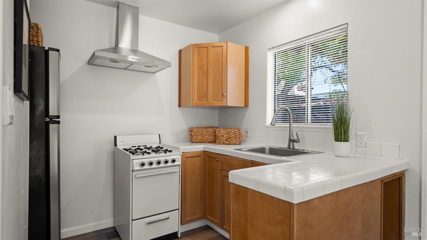 38 Bret Avenue San Rafael, CA 94901 - Photo 49 of 52 a kitchen with stainless steel appliances granite countertop a sink a stove and a refrigerator