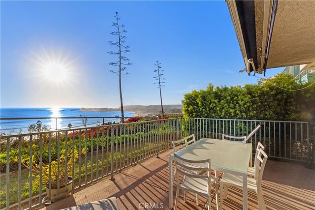 a view of a roof deck with wooden floor and fence