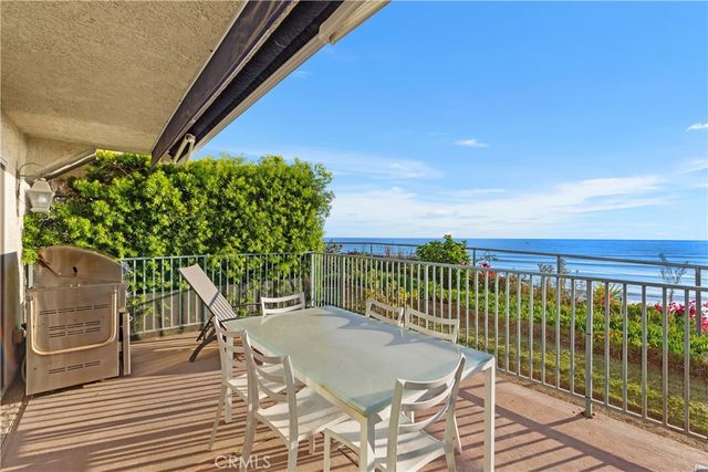 a view of a balcony with wooden floor