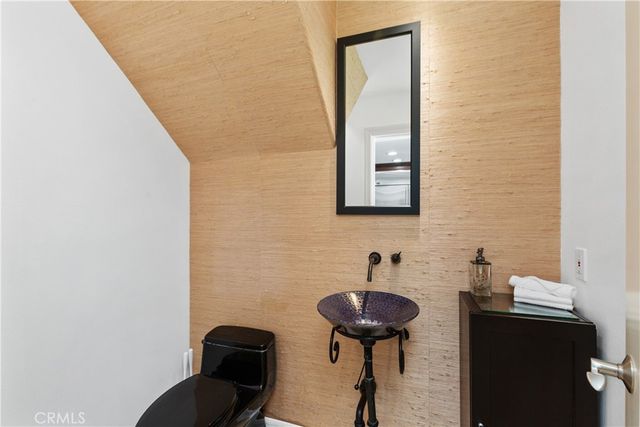 a view of a house with pool and sitting area