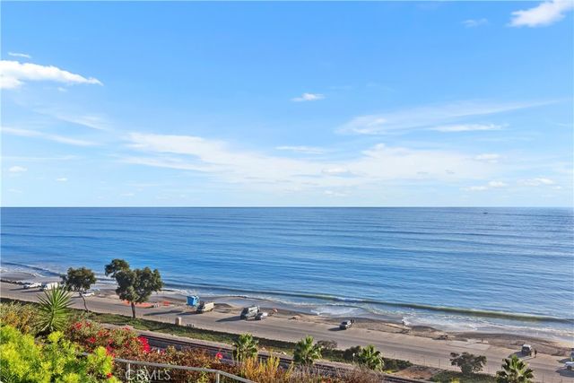 a view of a city with an ocean