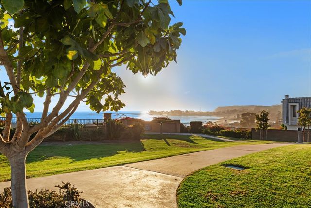 a view of a lake with a garden