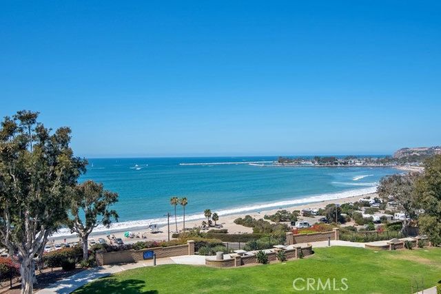 an aerial view of a houses with a yard