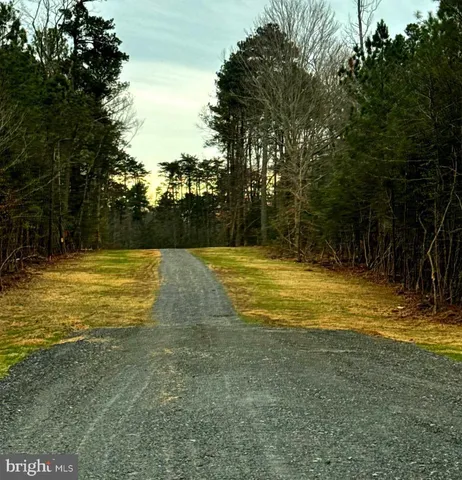 a view of a swimming pool with an outdoor space and seating area