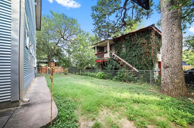 a backyard of a house with lots of green space