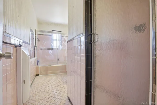 a bathroom with a bathtub and shower
