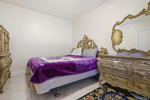 a bedroom with a bed and cabinets