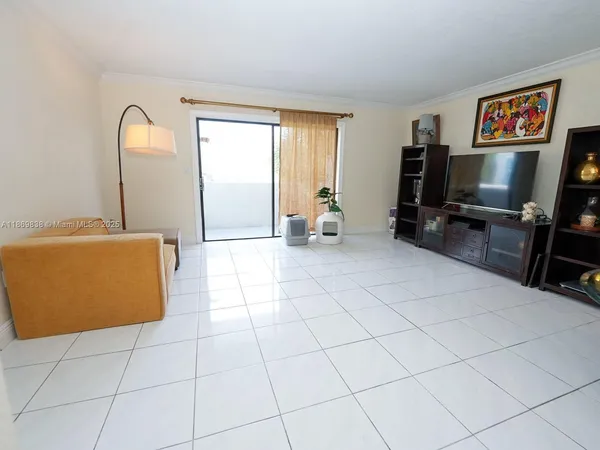 a living room with a couch and a flat screen tv