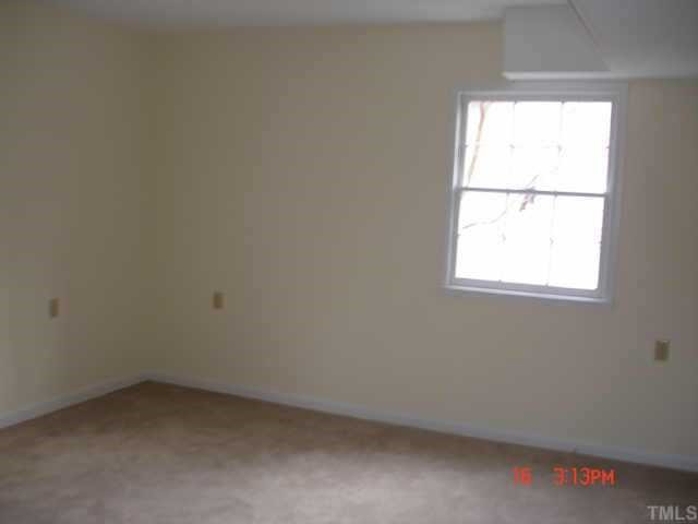 7408 Fiesta Way Raleigh, NC 27615 - Photo 8 of 10 Downstairs bedroom. There is also full bath downstairs and outside access. Could be used as in-law suite! Other
