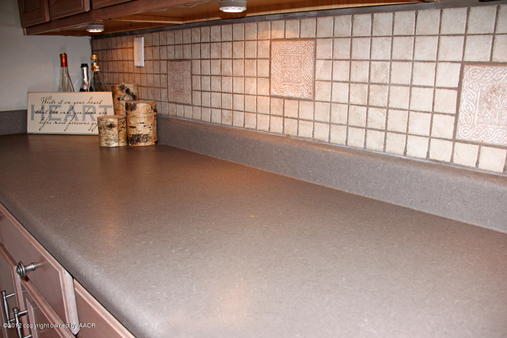 7208 Jameson Road Amarillo, TX 79106 - Photo 16 of 40 a view of a room with racks on the wall
