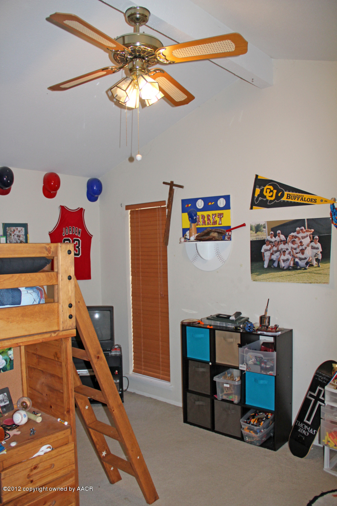 7208 Jameson Road Amarillo, TX 79106 - Photo 25 of 40 a view of a workspace with furniture and a ceiling fan