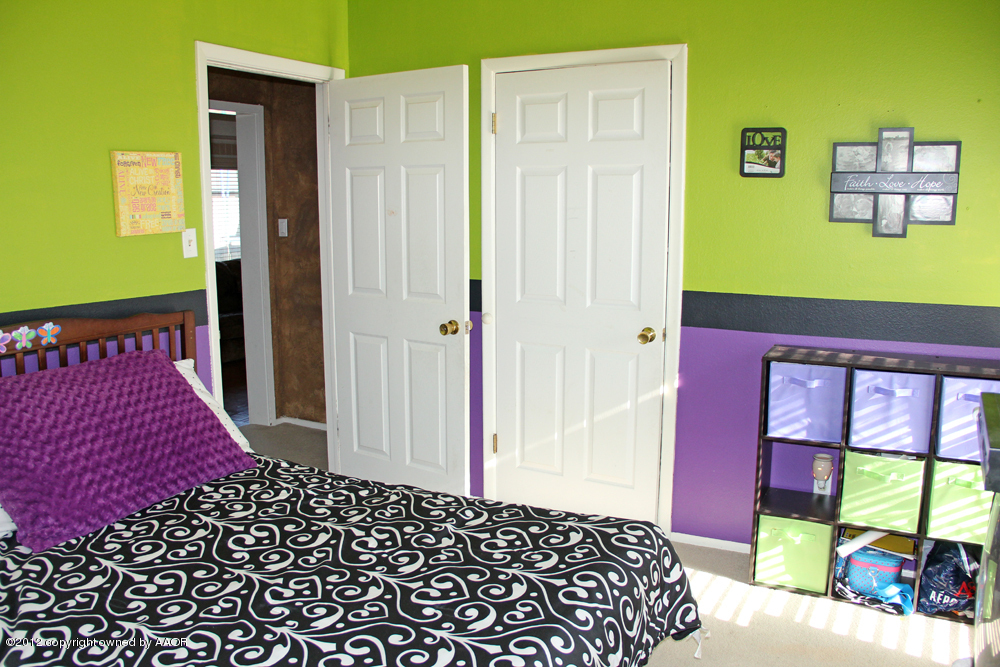 7208 Jameson Road Amarillo, TX 79106 - Photo 26 of 40 a bedroom with a bed and a window