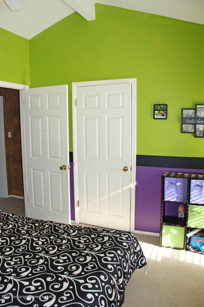 7208 Jameson Road Amarillo, TX 79106 - Photo 27 of 40 a view of a bedroom with bed and bathroom