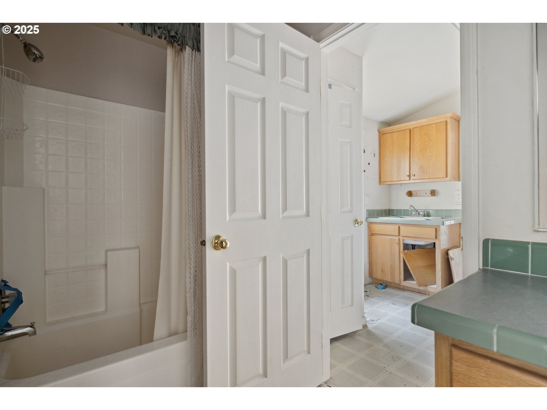 25482 East Cedar Glen Loop Welches, OR 97067 - Photo 16 of 20 a kitchen with white cabinets and sink
