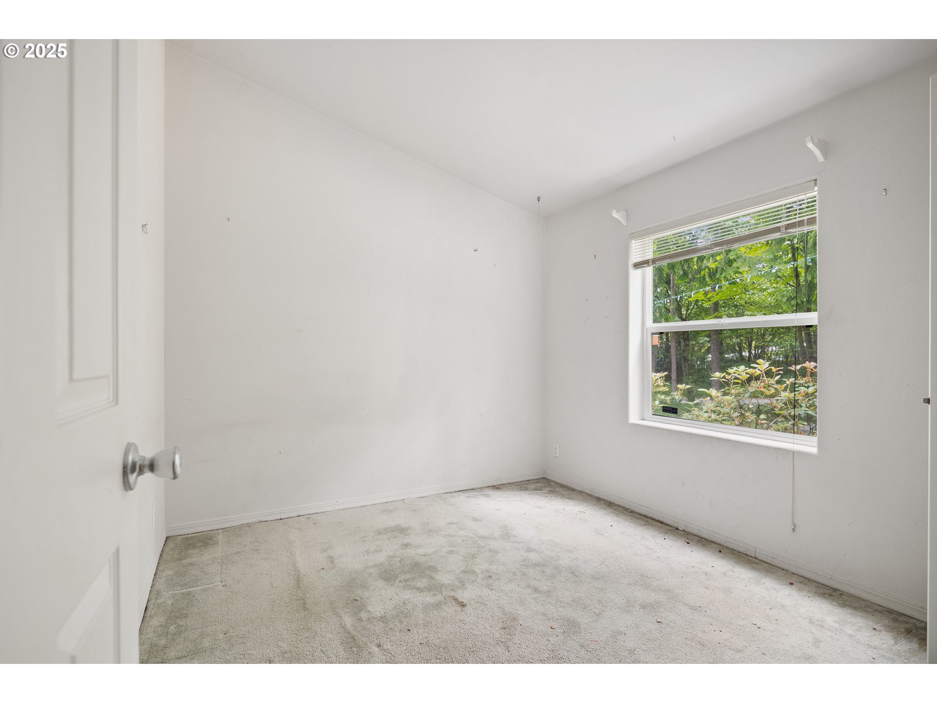 25482 East Cedar Glen Loop Welches, OR 97067 - Photo 17 of 20 a view of an empty room with a window