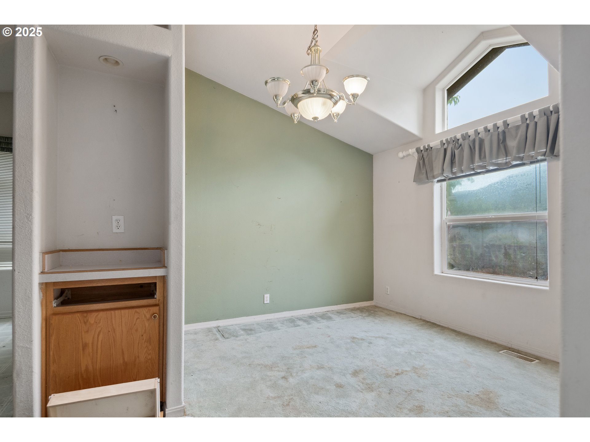 25482 East Cedar Glen Loop Welches, OR 97067 - Photo 8 of 20 a view of an empty room with a window