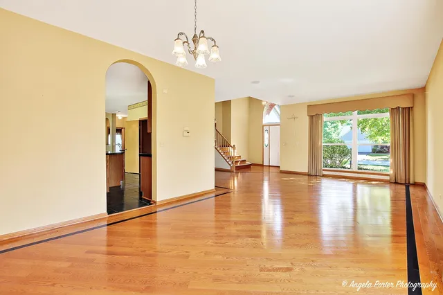 a view of a living room with hardwood floor and a view of a living room