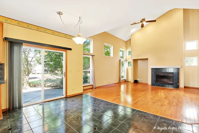 a view of an empty room with glass door