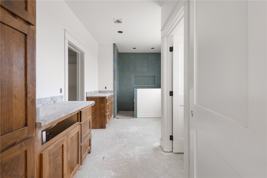 7873 Mathis Crk Drive Bryan, TX 77808 - Photo 12 of 14 a bathroom with double vanity and mirrors