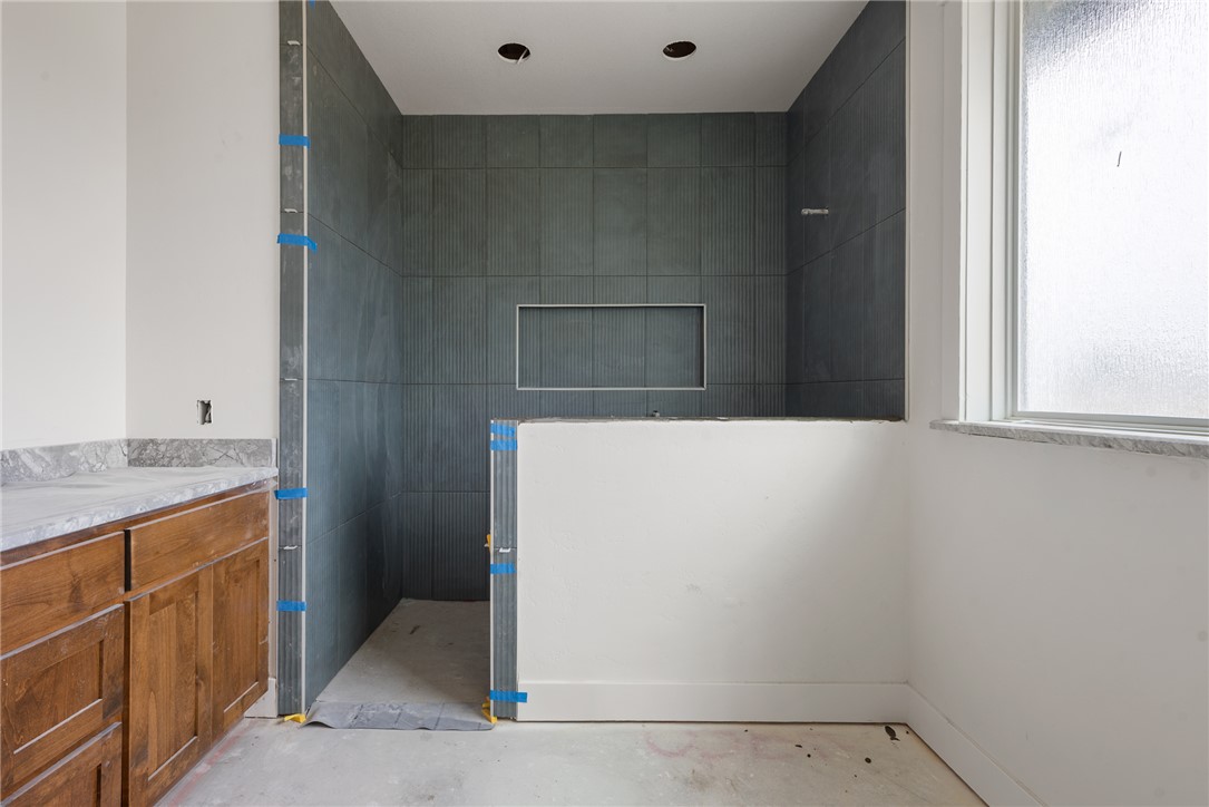 7873 Mathis Crk Drive Bryan, TX 77808 - Photo 13 of 14 a bathroom with a sink and a mirror