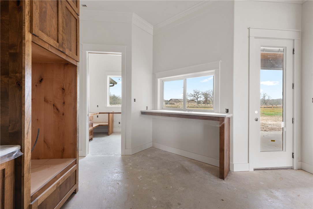 7873 Mathis Crk Drive Bryan, TX 77808 - Photo 9 of 14 a view of a hallway with bathroom and mirror
