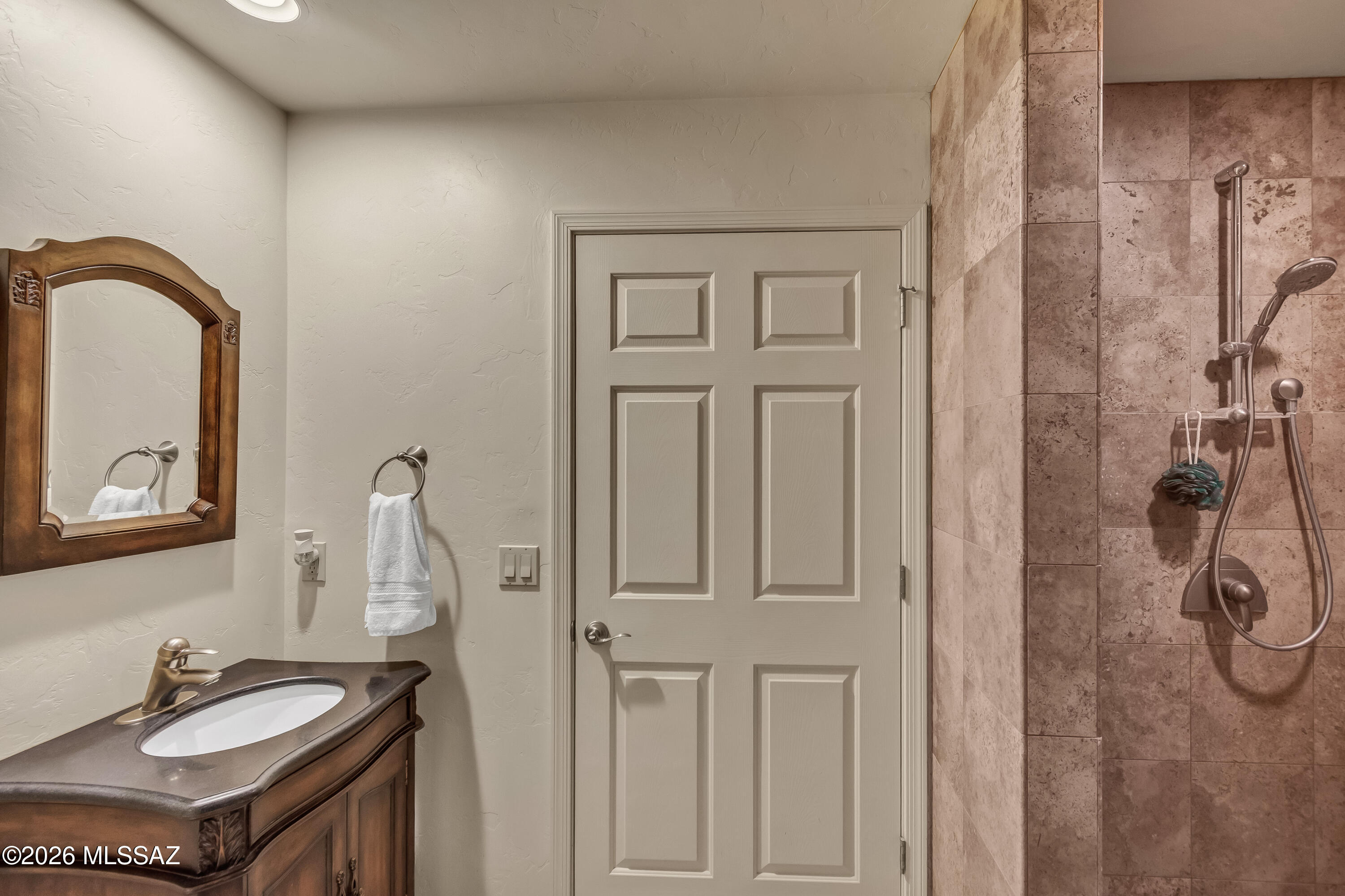 720 East Rudasill Road Tucson, AZ 85718 - Photo 27 of 48 Jack & Jill Bath between the 3rd bedroom and guest suite. Functions as a 2nd bathroom to the guest suite, or it could be locked off and only serve the 3rd bedroom.