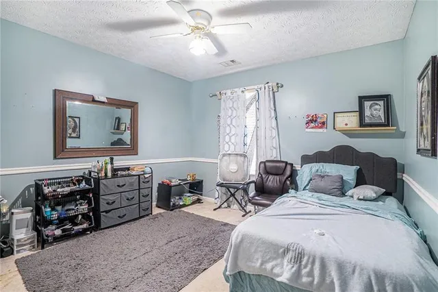 a bedroom with a bed and furniture