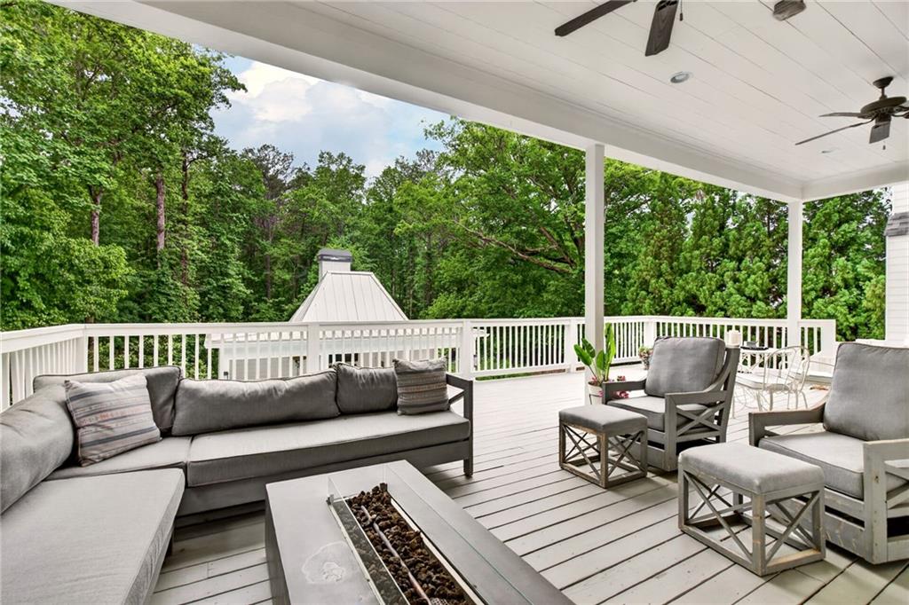 13460 New Providence Road Milton, GA 30004 - Photo 19 of 60 a balcony with furniture and a potted plant