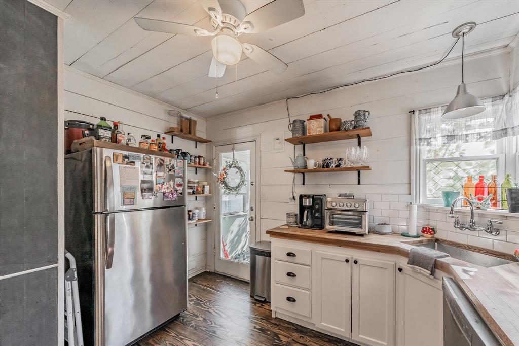 3516 Primrose Avenue Fort Worth, TX 76111 - Photo 15 of 30 a kitchen with stainless steel appliances a refrigerator a sink and cabinets