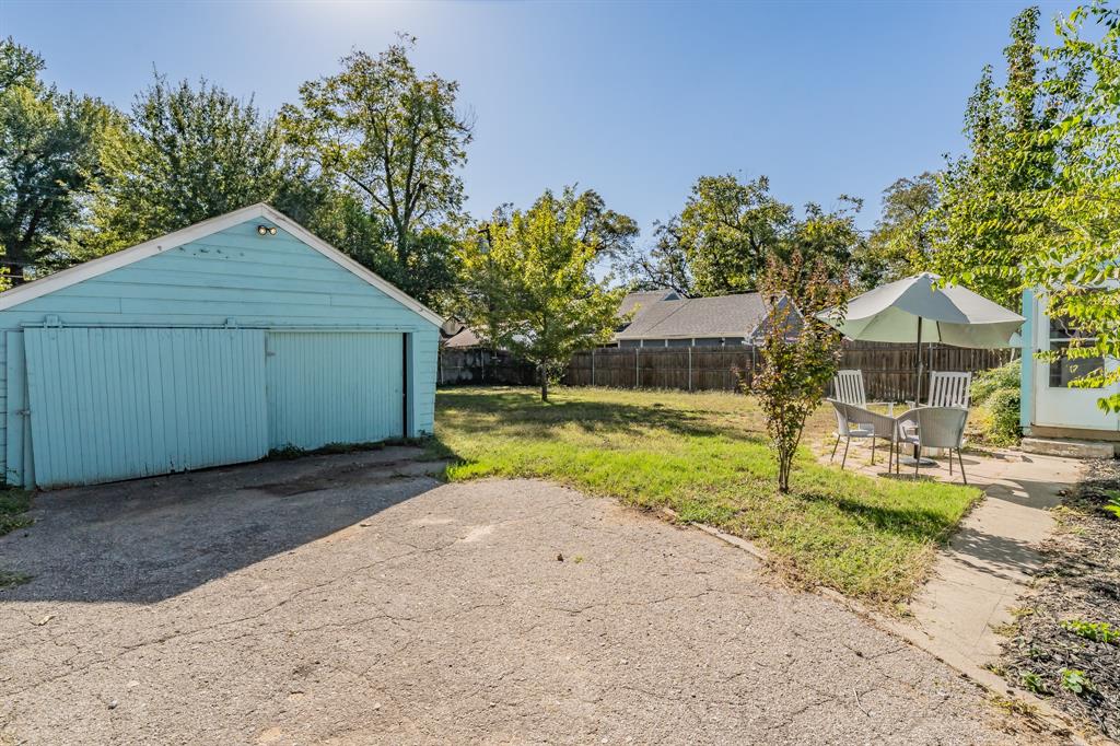 3516 Primrose Avenue Fort Worth, TX 76111 - Photo 28 of 30 a house view with swimming pool and garden space