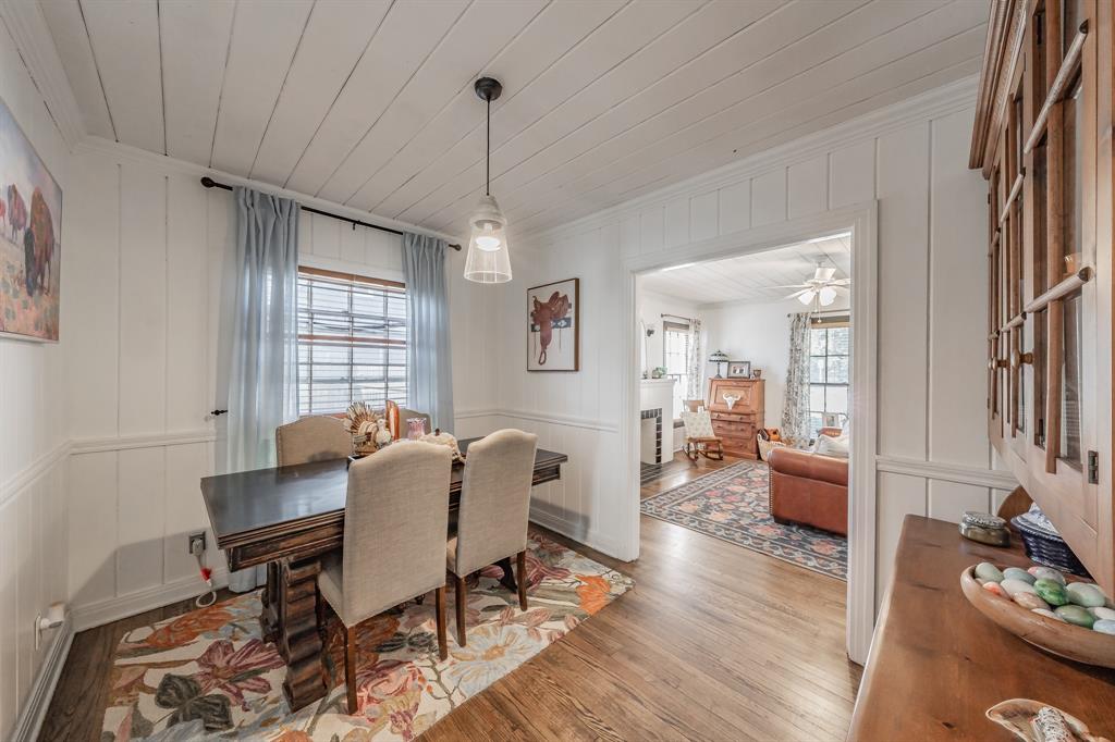 3516 Primrose Avenue Fort Worth, TX 76111 - Photo 9 of 30 a dining room with furniture a chandelier and wooden floor