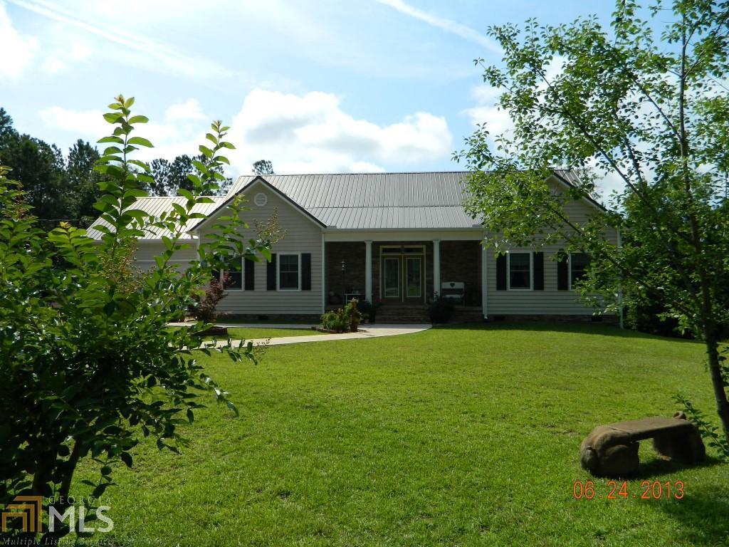 75 Nelson Road Thomaston, GA 30286 - Photo 1 of 1 a front view of a house with a garden